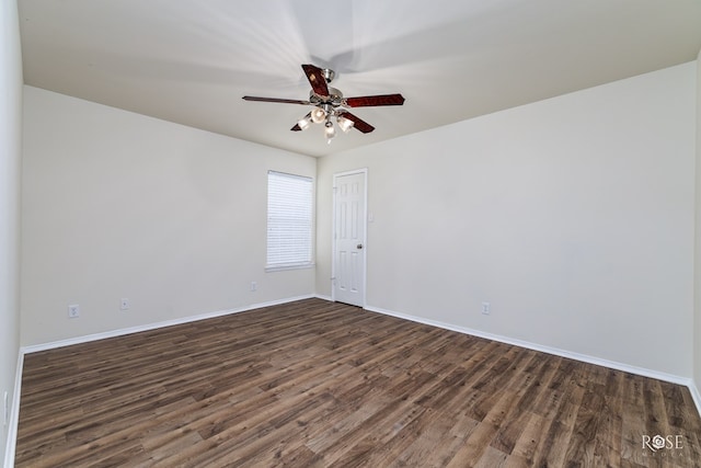 empty room with dark wood-type flooring and ceiling fan