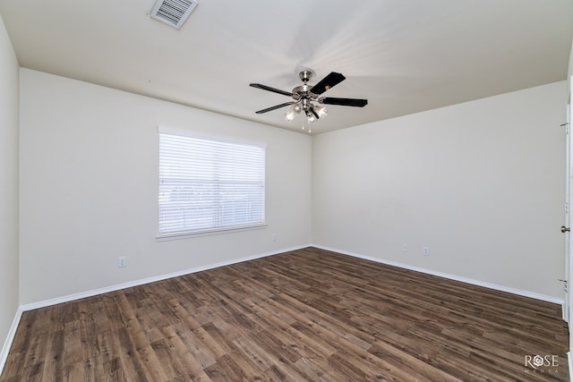 unfurnished room with dark wood-type flooring and ceiling fan