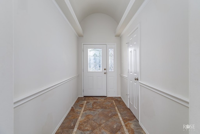 doorway to outside featuring lofted ceiling