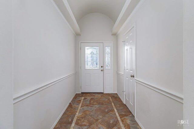 doorway to outside with vaulted ceiling