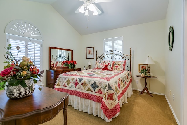 bedroom featuring light carpet, vaulted ceiling, and ceiling fan