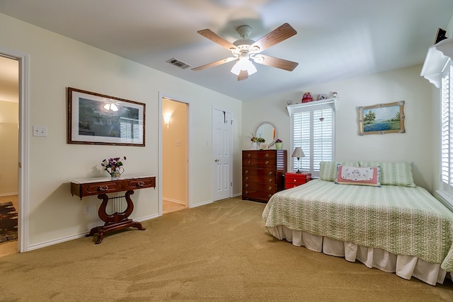 carpeted bedroom featuring ceiling fan