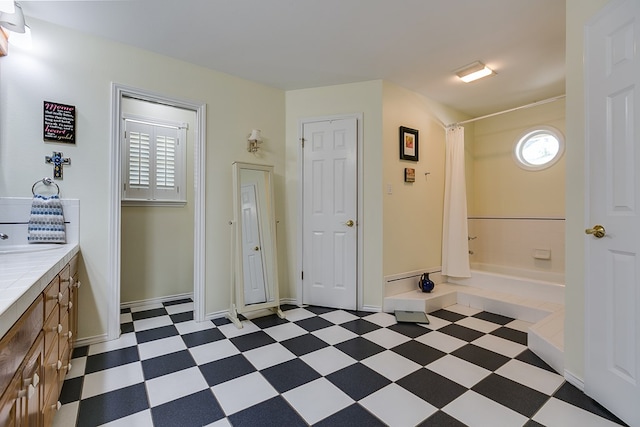 bathroom with vanity and shower / bath combo