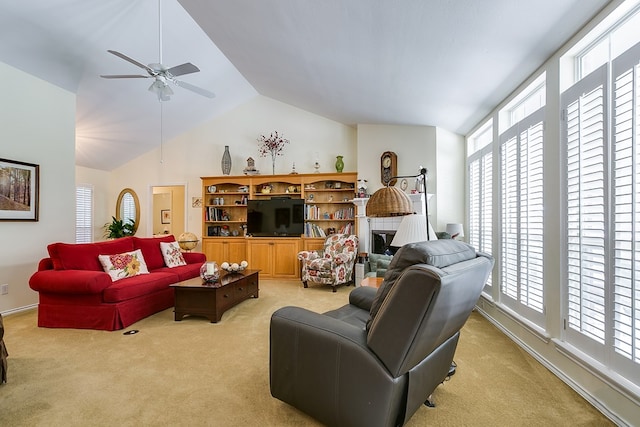 carpeted living room featuring lofted ceiling and ceiling fan