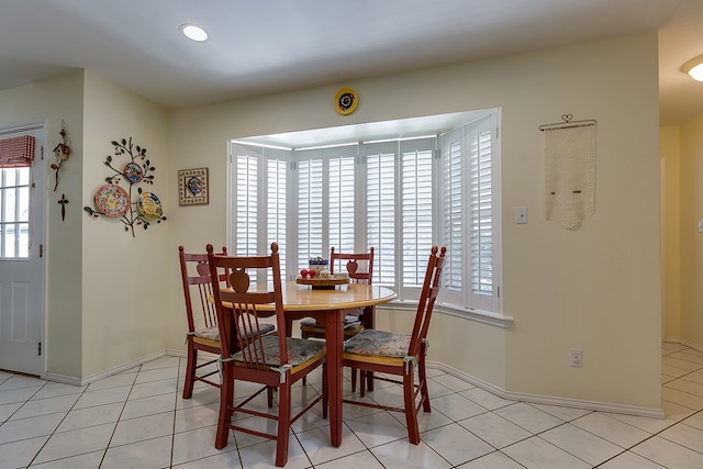 dining area featuring light tile patterned floors