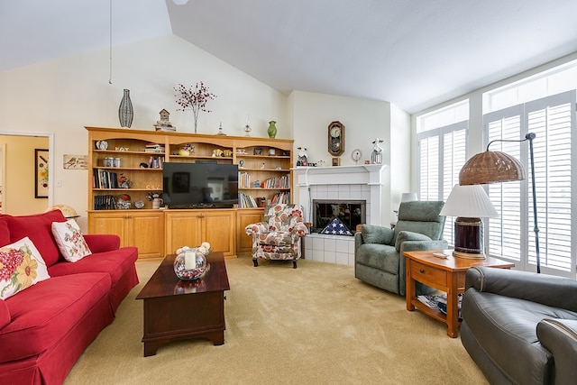 living room featuring lofted ceiling, light carpet, and a fireplace