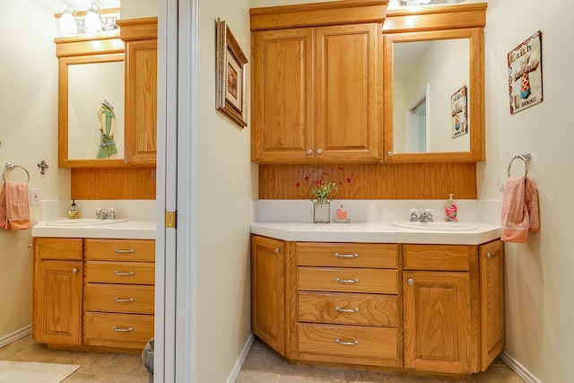 bathroom with vanity and tile patterned floors