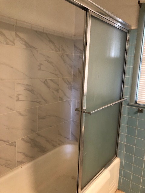 bathroom featuring enclosed tub / shower combo