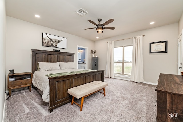 bedroom featuring light colored carpet and ceiling fan