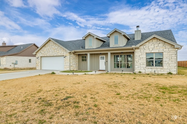 view of front of property featuring a garage and a front yard