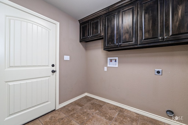 laundry room featuring washer hookup, electric dryer hookup, and cabinets