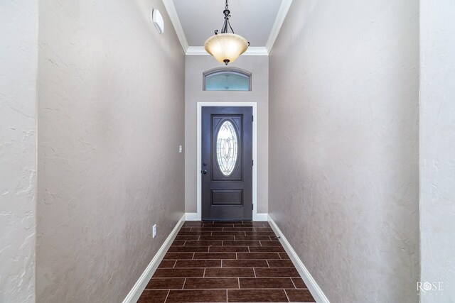 doorway to outside with ornamental molding