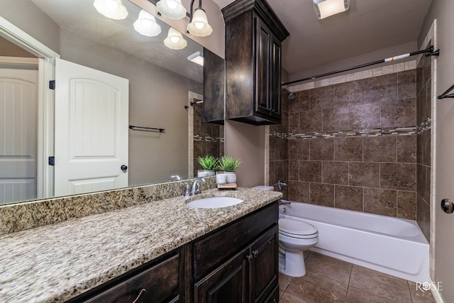 full bathroom featuring vanity, toilet, tiled shower / bath, and an inviting chandelier