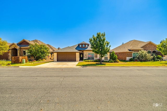 ranch-style home featuring a garage