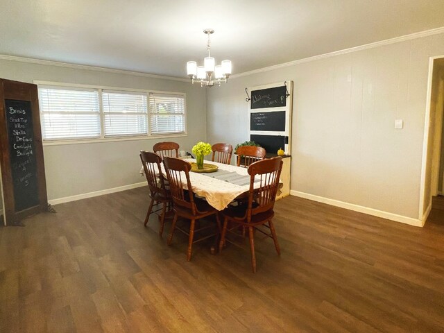 dining area with an inviting chandelier, dark hardwood / wood-style floors, and crown molding