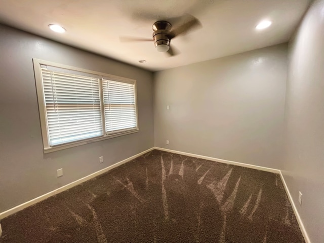 carpeted empty room featuring ceiling fan