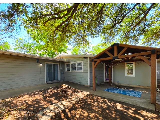 back of property with a patio area