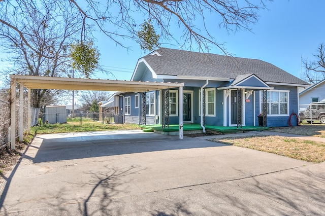 view of front of property featuring a carport