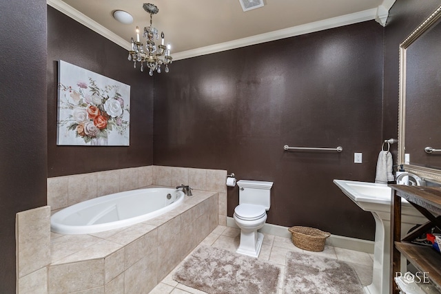 bathroom featuring a chandelier, a relaxing tiled tub, toilet, crown molding, and tile patterned floors