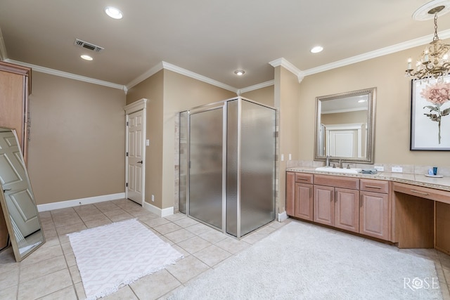 bathroom with crown molding, vanity, a shower with shower door, and tile patterned flooring