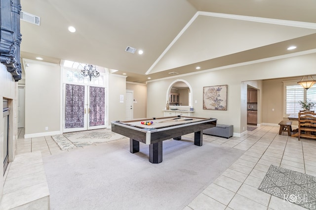 playroom featuring crown molding, high vaulted ceiling, french doors, and light tile patterned flooring