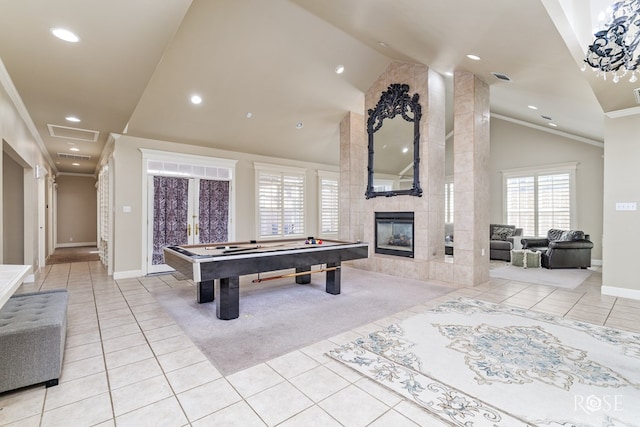 playroom with high vaulted ceiling, a fireplace, pool table, light tile patterned floors, and crown molding