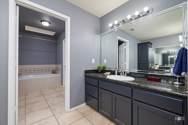 4122 Harmony Ln, San Angelo, TX 76904 - bathroom with tile patterned flooring, vanity, and a bath