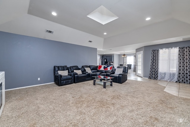 4122 Harmony Ln, San Angelo, TX 76904 - living room with light carpet, lofted ceiling, recessed lighting, and a skylight