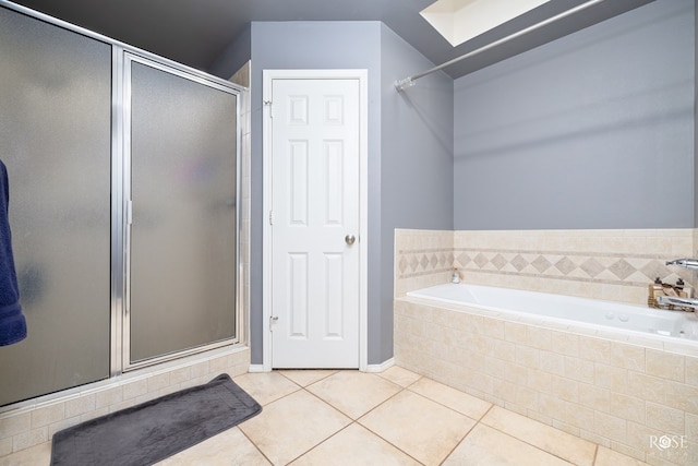 4122 Harmony Ln, San Angelo, TX 76904 - bathroom with a shower stall, tile patterned flooring, and a bath