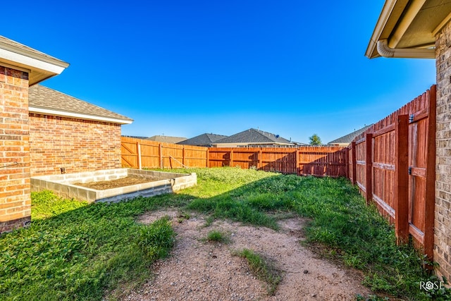 4122 Harmony Ln, San Angelo, TX 76904 - fenced backyard with a vegetable garden