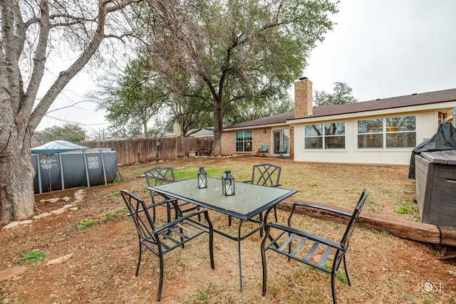 view of yard with a covered pool