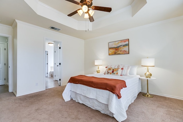 1113 Windemere Cir, San Angelo, TX 76901 - carpeted bedroom featuring a raised ceiling, crown molding, baseboards, and a ceiling fan