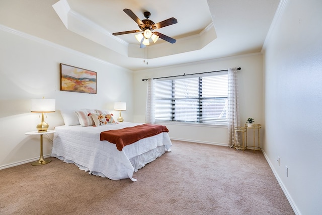 1113 Windemere Cir, San Angelo, TX 76901 - carpeted bedroom featuring a tray ceiling, crown molding, baseboards, and ceiling fan