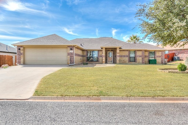 1113 Windemere Cir, San Angelo, TX 76901 - ranch-style house featuring a garage, driveway, brick siding, and roof with shingles