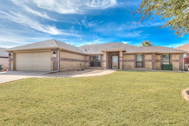 1113 Windemere Cir, San Angelo, TX 76901 - view of front of property featuring brick siding, a garage, concrete driveway, a front lawn, and roof with shingles