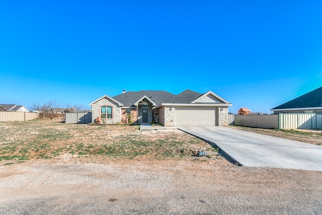 ranch-style house featuring a garage