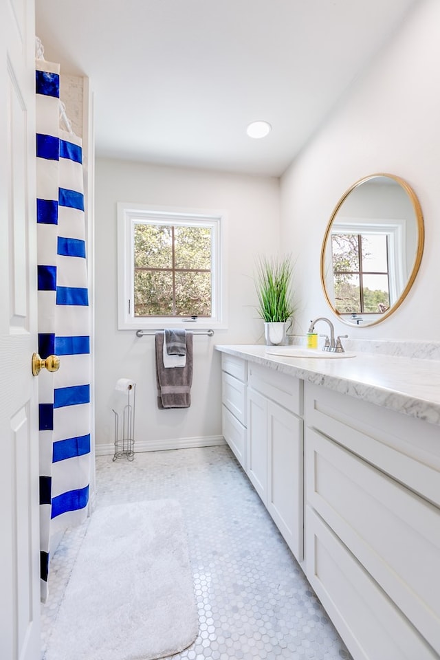2622 Oxford Ave, San Angelo, TX 76904 - full bathroom with vanity, plenty of natural light, and a shower with curtain