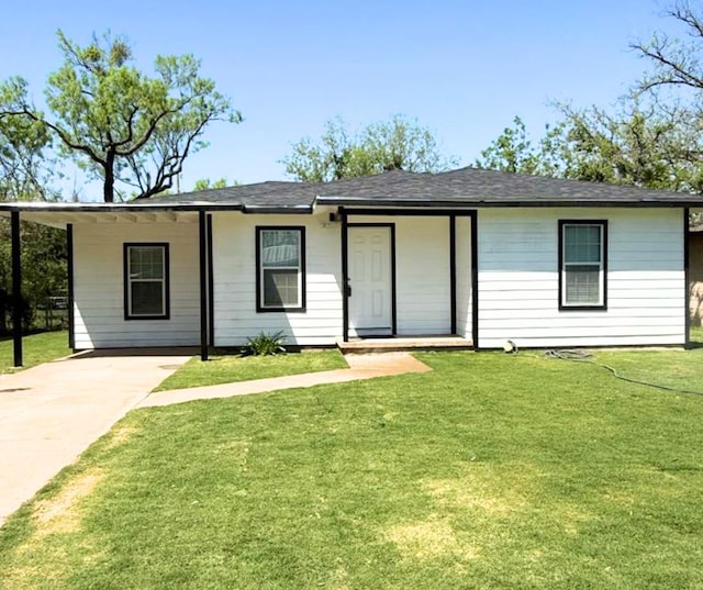 1122 E 20th St, San Angelo, TX 76903 - ranch-style home featuring a front yard, concrete driveway, and roof with shingles