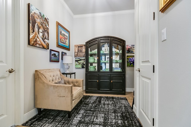 foyer entrance featuring hardwood / wood-style flooring and ornamental molding