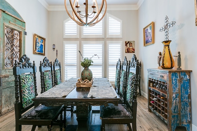 dining room with crown molding, a chandelier, and hardwood / wood-style floors