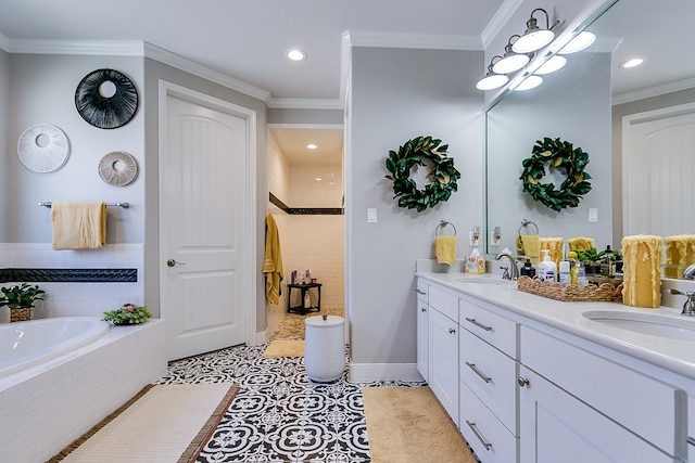 bathroom with vanity, tiled tub, crown molding, and tile patterned flooring