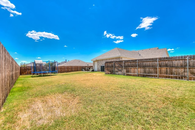 view of yard with a trampoline