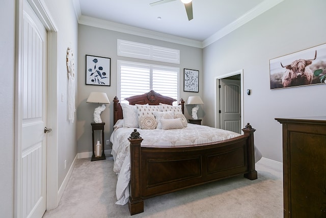 bedroom featuring crown molding, ceiling fan, and light carpet