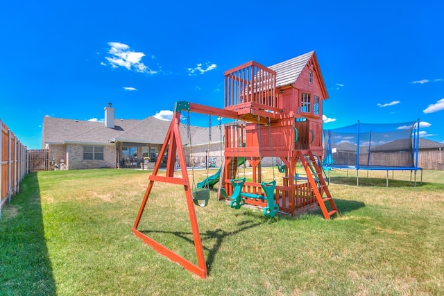 view of playground featuring a yard and a trampoline