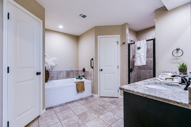 bathroom featuring visible vents, a stall shower, a sink, tile patterned floors, and a bath