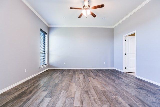 spare room featuring dark wood-style flooring, a ceiling fan, baseboards, and ornamental molding