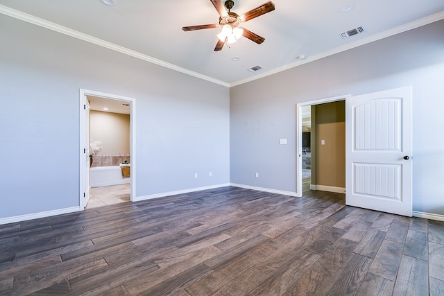 unfurnished bedroom with visible vents, baseboards, wood finished floors, and crown molding