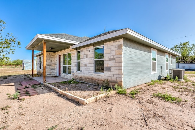 view of property exterior with central AC unit