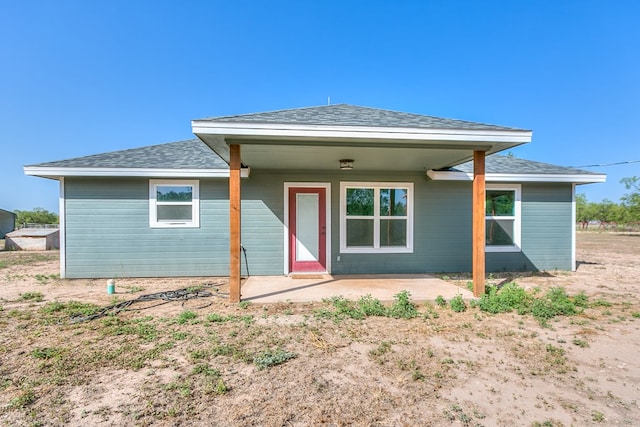 rear view of property featuring a patio area