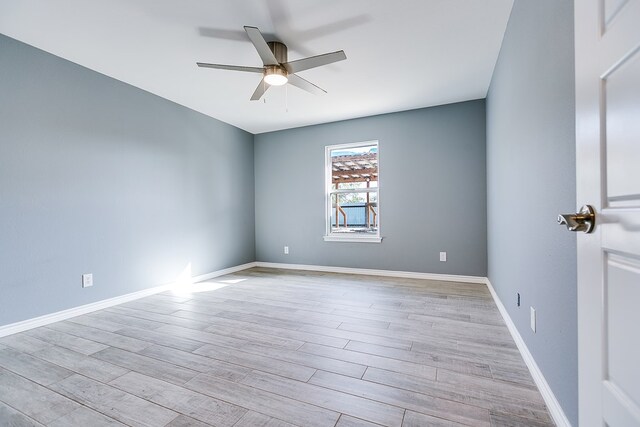 spare room with ceiling fan and light hardwood / wood-style floors